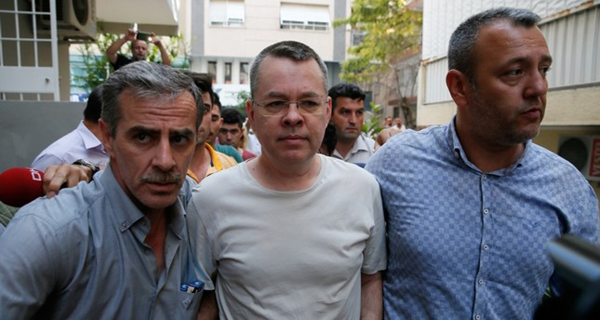 Pastor Andrew Brunson (C) is escorted by police officers while he is being transferred to his home where he will remain in house arrest, on July 25, 2018, in Izmir, western Turkey. (AA Photo)