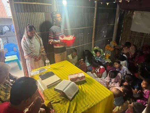 Children gather in Shana's house to learn about Jesus.